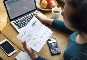 Woman checking shipping letter